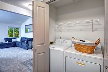 a washer and dryer in the laundry room of a house